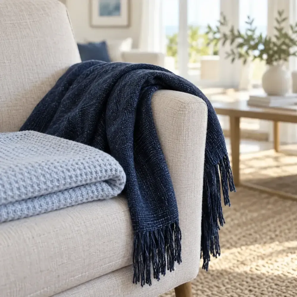 Throws styled on an armchair next to blanket